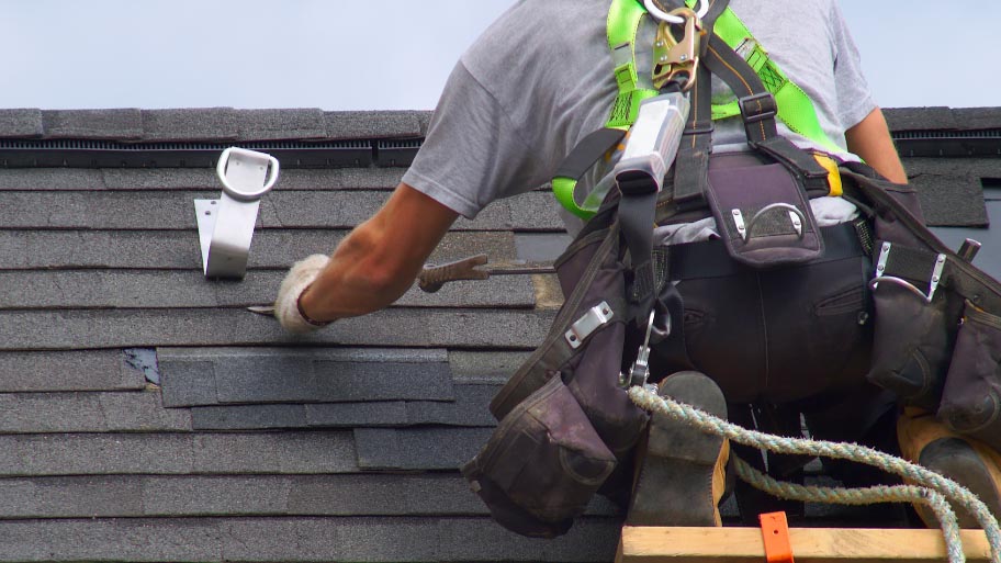 Roofing contractor doing an inspection