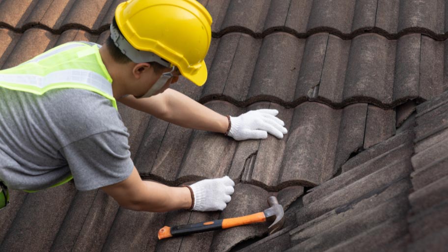 Man Repairing His Roof in Perry, IA -Roof Repair Tips